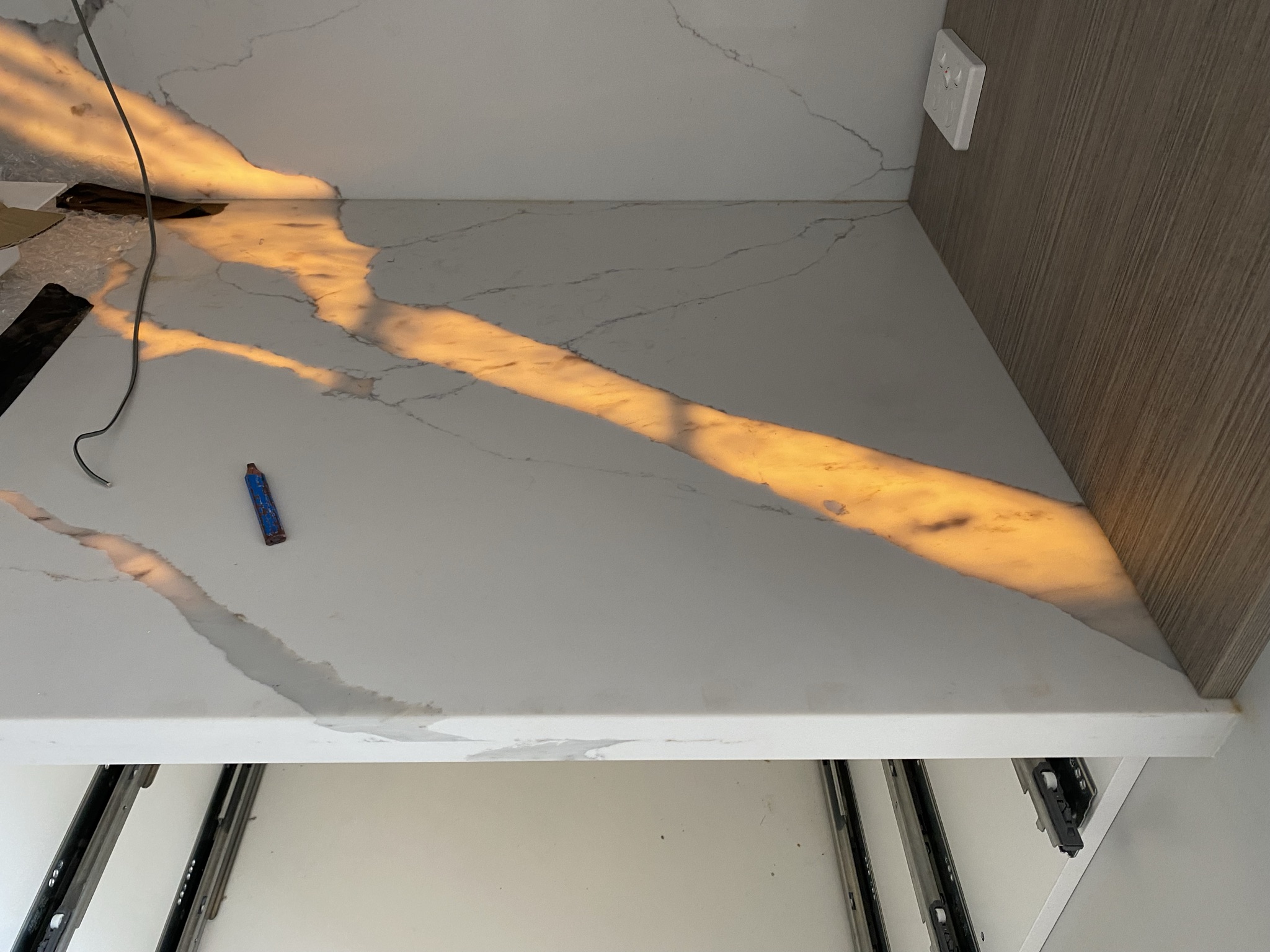 Backlit stone benchtop and splashback with integrated LED feature lighting