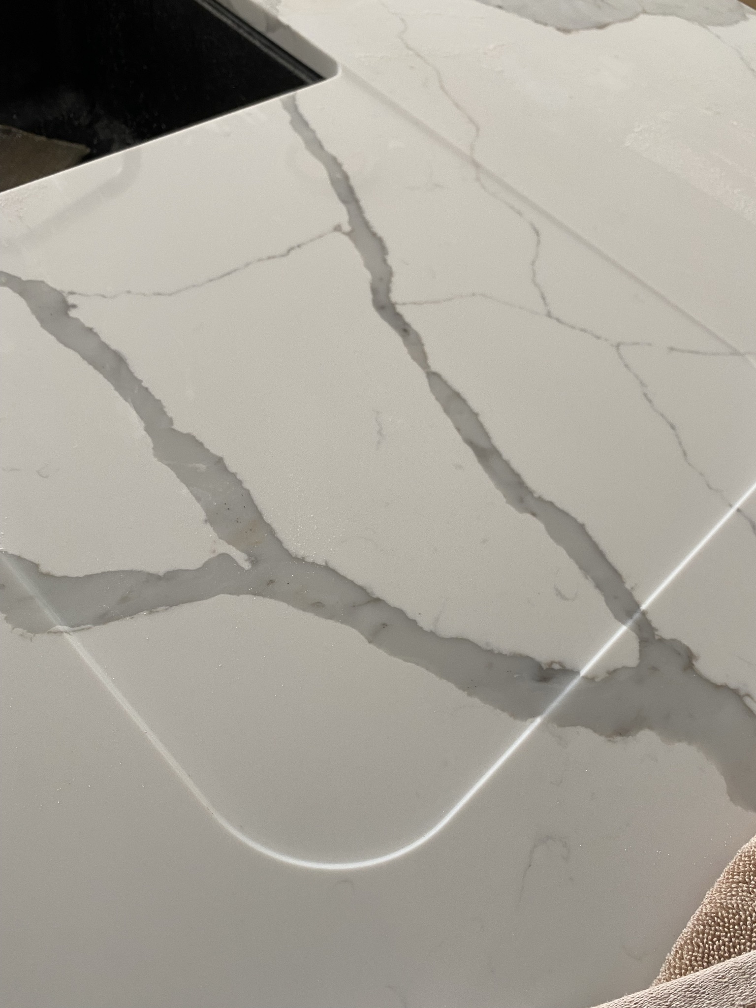 Recessed linear LED lighting channel flush-mounted into a stone benchtop